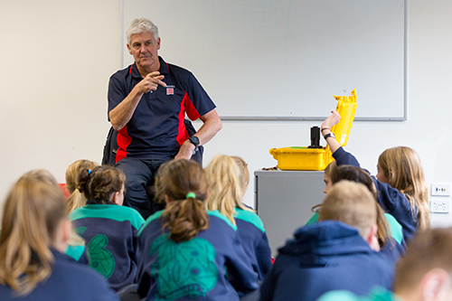 Volunteer talking in a school classroom