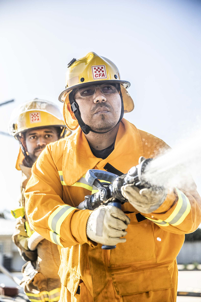 Firefighters with hose