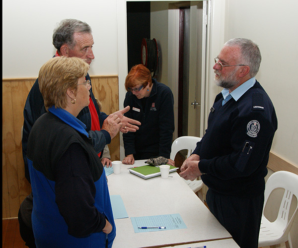 Volunteer talking to members of the public