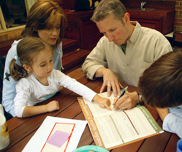 Family writing bushfire plan