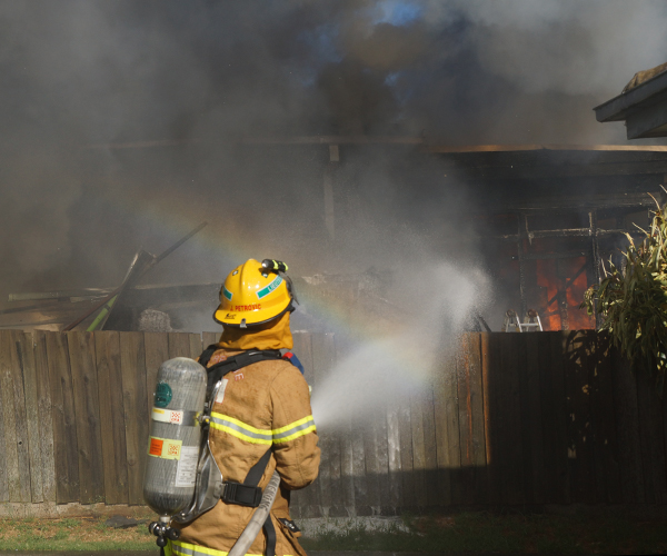 Firefighter putting out fire