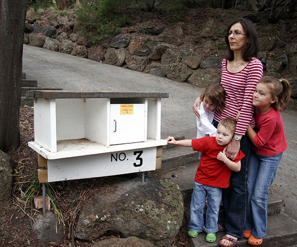 Family evacuating and waiting at mailbox