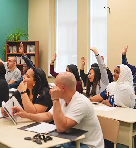 Multicultural class raising hands 460