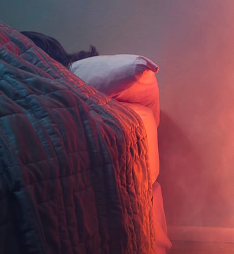 Person sleeping smoke filled bedroom 460
