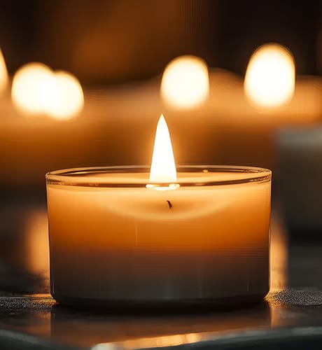 Tea candles lit on table 460