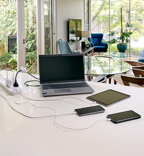 Devices charging on kitchen bench 460