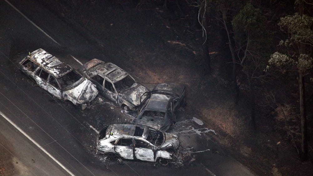 Four burnt cars that failed to make it out of Kingsville during the Black Saturday bushfires in February 2009. They have crashed into each other and are completely burnt through. 
