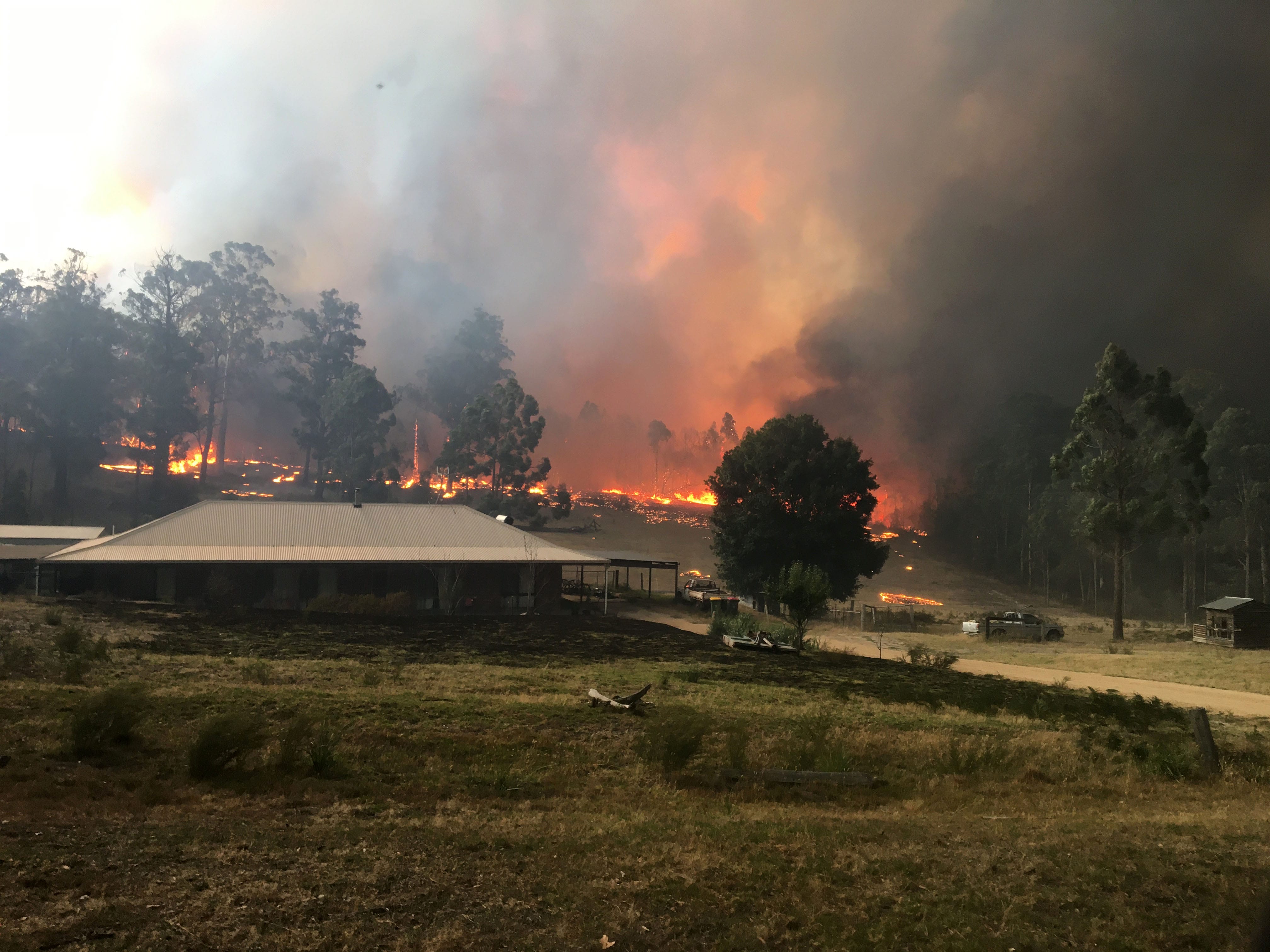 Fire approaching house from behind