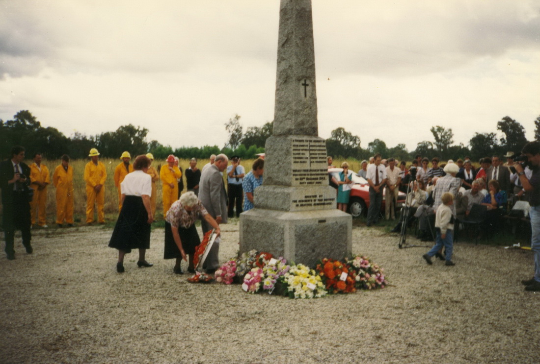 Laying flowers at Tarrawingee past memorial